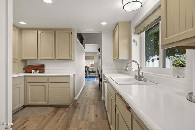 3051 Ketch Pl, Oxnard, CA 93035 - kitchen featuring light countertops, recessed lighting, light wood-style flooring, light brown cabinetry, and dishwashing machine