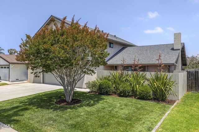 3051 Ketch Pl, Oxnard, CA 93035 - view of front facade with concrete driveway, a chimney, a shingled roof, and stucco siding