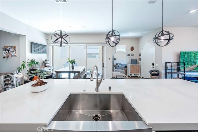 143 Interval, Irvine, CA 92618 - kitchen featuring open floor plan, light countertops, pendant lighting, and recessed lighting