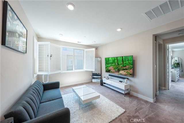 143 Interval, Irvine, CA 92618 - living area with carpet flooring and recessed lighting