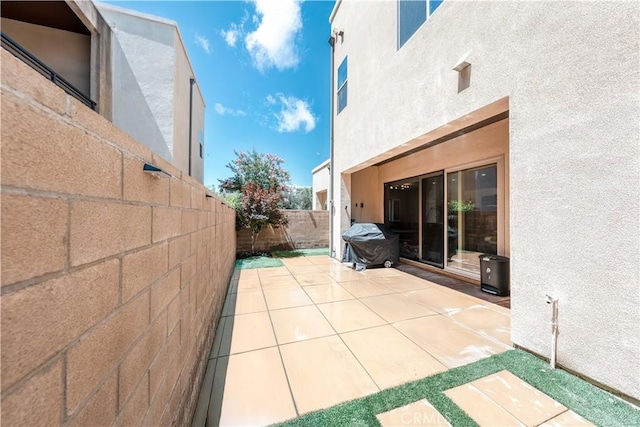 143 Interval, Irvine, CA 92618 - fenced backyard with a patio area and a grill