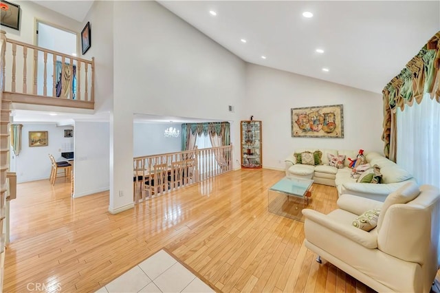 11830 Killimore Ave, Porter Ranch, CA 91326 - living area featuring high vaulted ceiling, light wood-style flooring, and recessed lighting