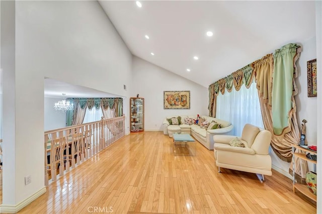 11830 Killimore Ave, Porter Ranch, CA 91326 - living room with a chandelier, high vaulted ceiling, light wood-style floors, and recessed lighting