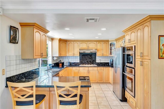 11830 Killimore Ave, Porter Ranch, CA 91326 - kitchen featuring light brown cabinetry, under cabinet range hood, a peninsula, recessed lighting, and crown molding