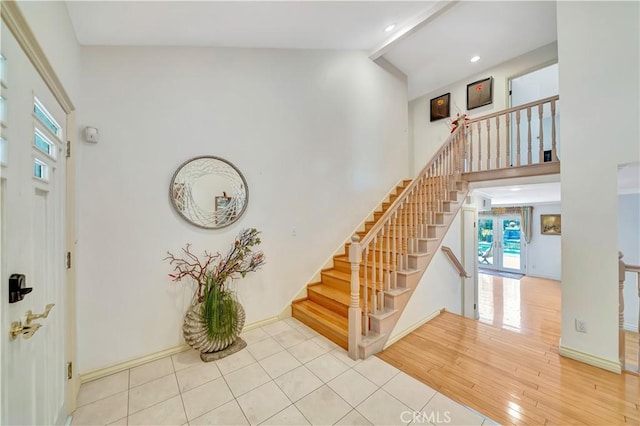 11830 Killimore Ave, Porter Ranch, CA 91326 - foyer with stairway, high vaulted ceiling, beam ceiling, wood finished floors, and recessed lighting