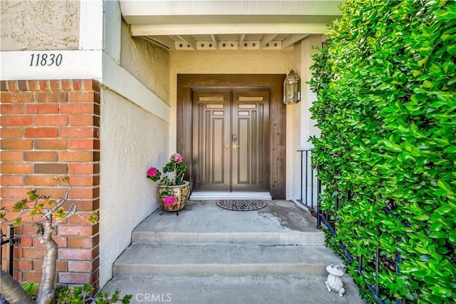 11830 Killimore Ave, Porter Ranch, CA 91326 - view of exterior entry with stucco siding and brick siding