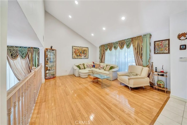 11830 Killimore Ave, Porter Ranch, CA 91326 - living area featuring high vaulted ceiling, recessed lighting, and wood finished floors