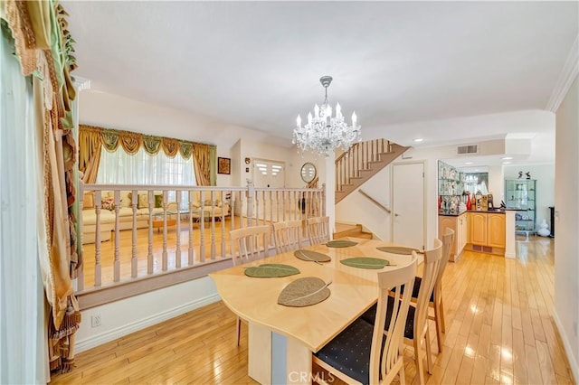 11830 Killimore Ave, Porter Ranch, CA 91326 - dining area with stairs, light wood-type flooring, and a chandelier