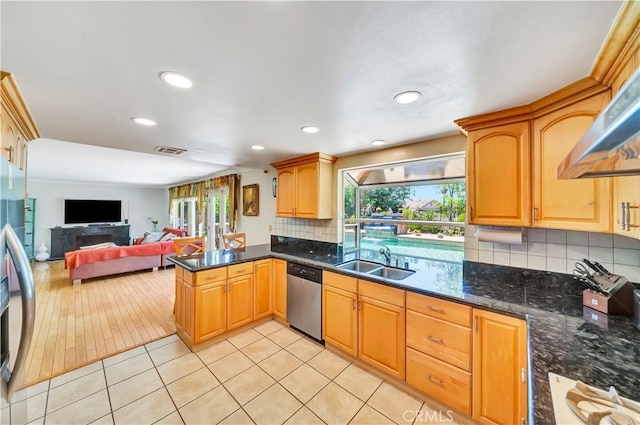 11830 Killimore Ave, Porter Ranch, CA 91326 - kitchen featuring appliances with stainless steel finishes, wall chimney exhaust hood, backsplash, open floor plan, and recessed lighting