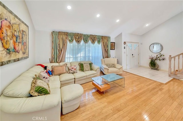 11830 Killimore Ave, Porter Ranch, CA 91326 - living area with vaulted ceiling, wood finished floors, recessed lighting, and stairs