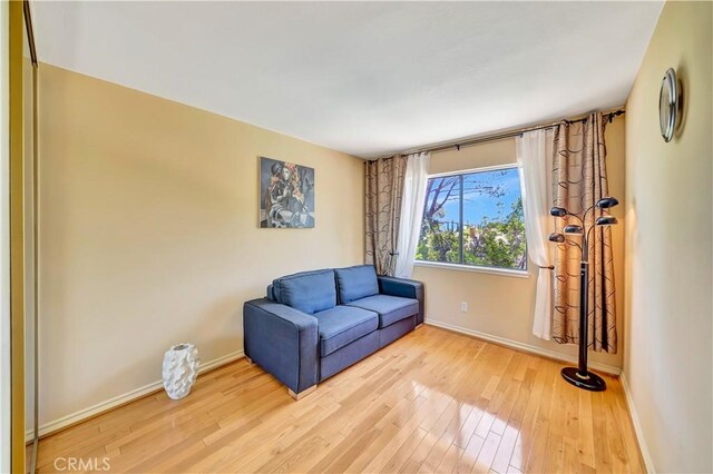 11830 Killimore Ave, Porter Ranch, CA 91326 - sitting room featuring wood finished floors and baseboards