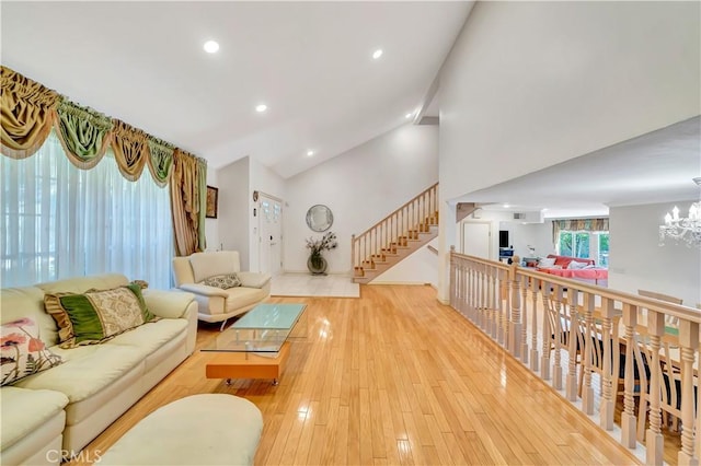 11830 Killimore Ave, Porter Ranch, CA 91326 - living room featuring a chandelier, stairs, light wood-type flooring, high vaulted ceiling, and recessed lighting