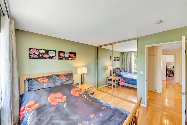 11830 Killimore Ave, Porter Ranch, CA 91326 - bedroom featuring wood finished floors and a closet