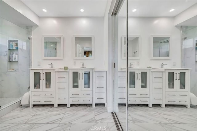 11830 Killimore Ave, Porter Ranch, CA 91326 - full bathroom featuring marble finish flooring, a marble finish shower, two vanities, and recessed lighting