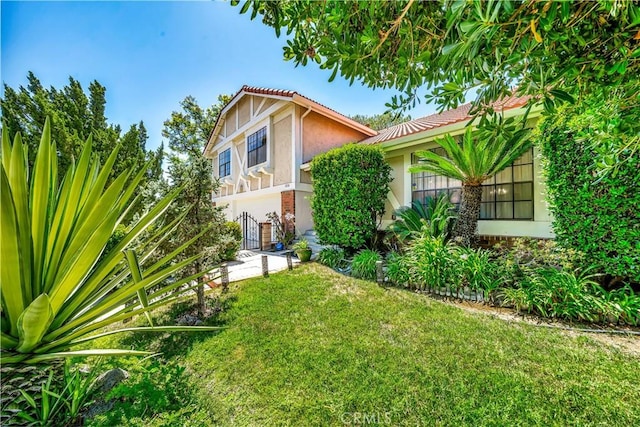 11830 Killimore Ave, Porter Ranch, CA 91326 - view of front facade featuring stucco siding and a front yard