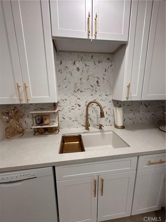 6350 Genesee Ave Unit 107, San Diego, CA 92122 - kitchen featuring white dishwasher, tasteful backsplash, light countertops, and white cabinets