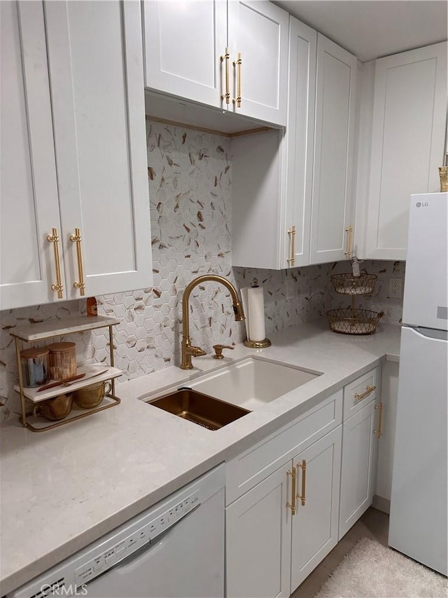 6350 Genesee Ave Unit 107, San Diego, CA 92122 - kitchen featuring white appliances, white cabinetry, light countertops, and decorative backsplash