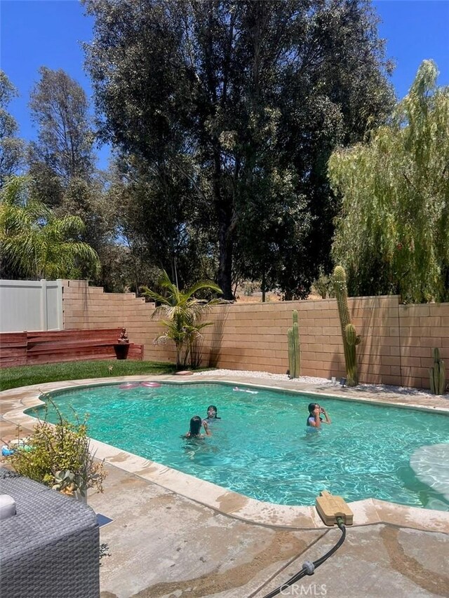 35658 Denali Way, Winchester, CA 92596 - view of swimming pool featuring a fenced backyard and a patio