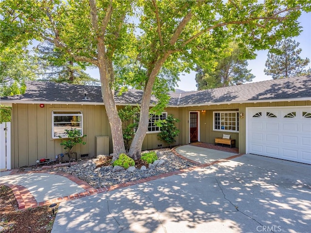 3828 2nd Ave, La Crescenta, CA 91214 - ranch-style home featuring roof with shingles, a garage, board and batten siding, and driveway
