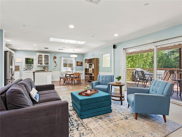 3828 2nd Ave, La Crescenta, CA 91214 - living room featuring light wood-style floors, recessed lighting, and a skylight