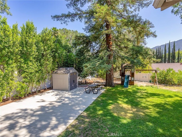 3828 2nd Ave, La Crescenta, CA 91214 - view of yard featuring a shed, a playground, a mountain view, and a patio