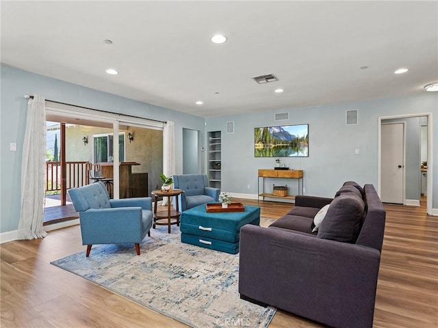 3828 2nd Ave, La Crescenta, CA 91214 - living room featuring wood finished floors, recessed lighting, and built in shelves