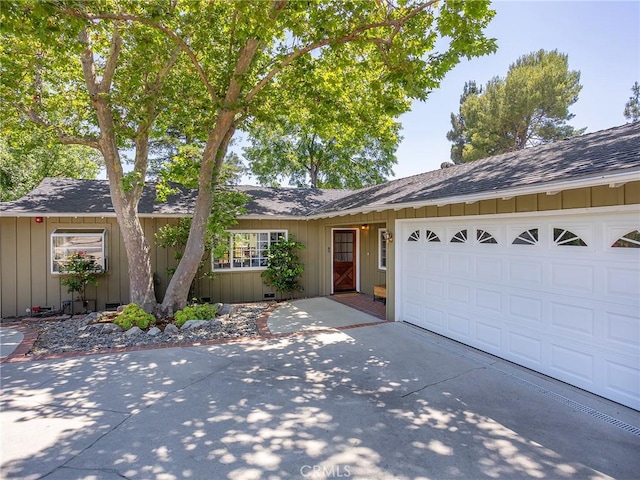 3828 2nd Ave, La Crescenta, CA 91214 - single story home with concrete driveway, roof with shingles, board and batten siding, and a garage