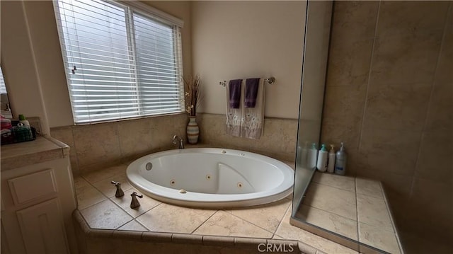 3242 Ashbury Ave, Madera, CA 93637 - full bathroom with healthy amount of natural light and a whirlpool tub