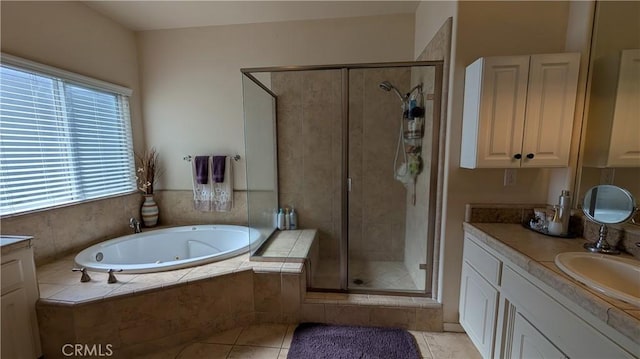 3242 Ashbury Ave, Madera, CA 93637 - bathroom with vanity, a stall shower, a tub with jets, and tile patterned floors