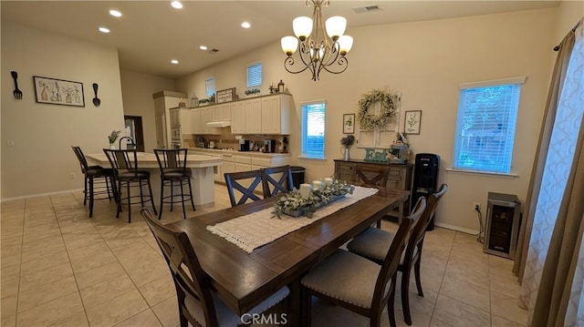 3242 Ashbury Ave, Madera, CA 93637 - dining space with a chandelier, light tile patterned floors, beverage cooler, and recessed lighting