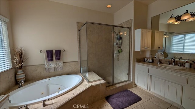 3242 Ashbury Ave, Madera, CA 93637 - bathroom with a stall shower, vanity, a whirlpool tub, and tile patterned flooring