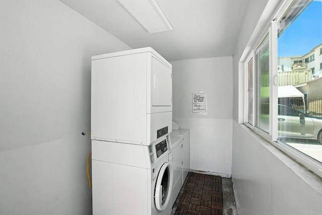 550206 E University Ave, San Diego, CA 92105 - washroom with stacked washer and clothes dryer and attic access