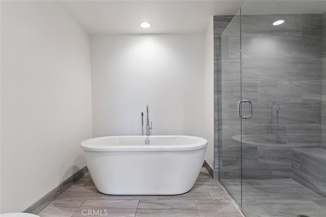 4240 Laurel Canyon Blvd Unit 307, Studio City, CA 91604 - full bathroom with a soaking tub, a stall shower, and recessed lighting