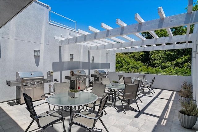 4240 Laurel Canyon Blvd Unit 307, Studio City, CA 91604 - view of patio featuring outdoor dining area, an outdoor kitchen, and a pergola
