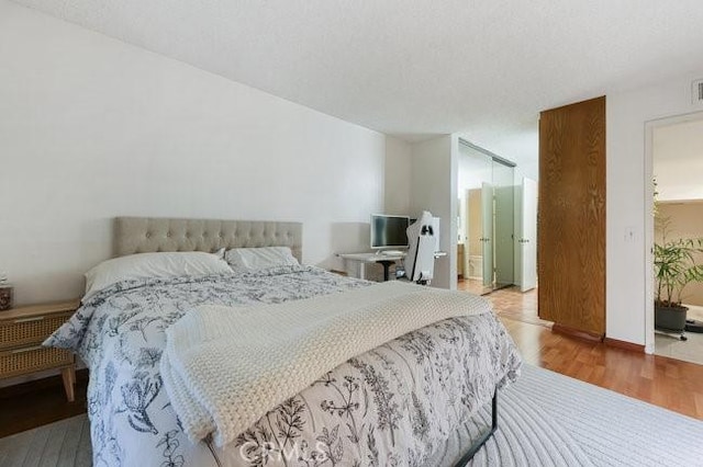 5885 El Cajon Blvd Unit 105, San Diego, CA 92115 - bedroom with wood finished floors and ensuite bath
