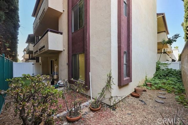 5885 El Cajon Blvd Unit 105, San Diego, CA 92115 - view of side of home featuring stucco siding