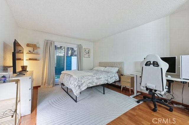 5885 El Cajon Blvd Unit 105, San Diego, CA 92115 - bedroom with wood finished floors and access to exterior