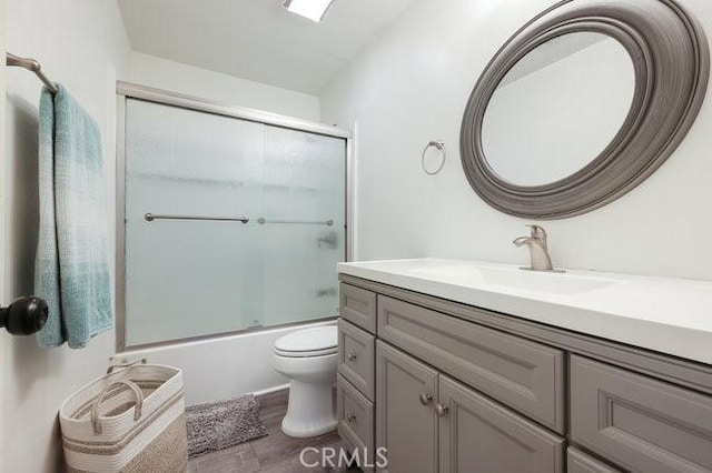 5885 El Cajon Blvd Unit 105, San Diego, CA 92115 - full bathroom featuring vanity, wood finished floors, and combined bath / shower with glass door