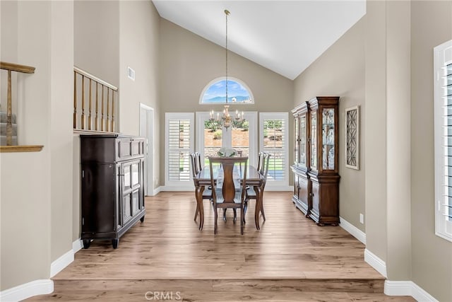 13982 Claremont Ln, Rancho Cucamonga, CA 91739 - dining room with a chandelier, light wood-style floors, and high vaulted ceiling