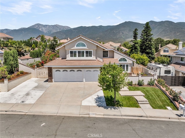 13982 Claremont Ln, Rancho Cucamonga, CA 91739 - traditional home featuring an attached garage, a mountain view, concrete driveway, stucco siding, and a tile roof