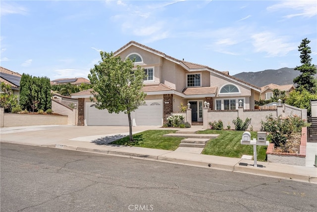 13982 Claremont Ln, Rancho Cucamonga, CA 91739 - view of front of house featuring concrete driveway, stucco siding, a garage, and a tile roof