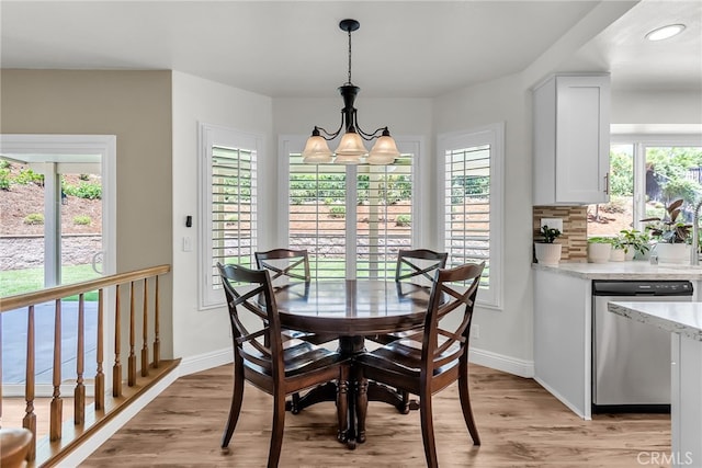 13982 Claremont Ln, Rancho Cucamonga, CA 91739 - dining space featuring plenty of natural light, light wood finished floors, a chandelier, and recessed lighting