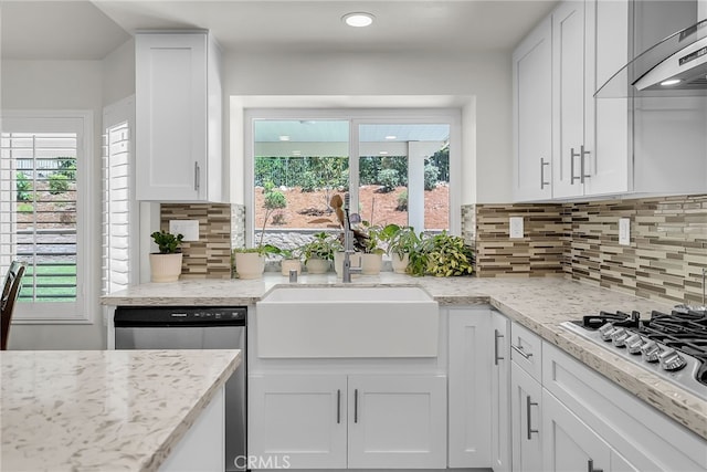 13982 Claremont Ln, Rancho Cucamonga, CA 91739 - kitchen featuring stainless steel appliances, under cabinet range hood, white cabinetry, and healthy amount of natural light