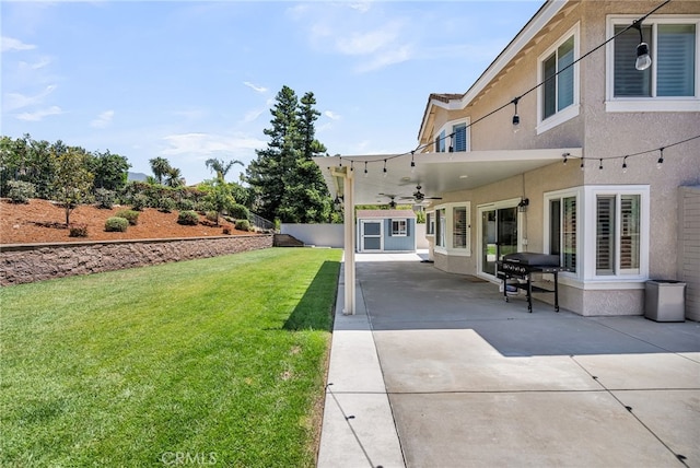 13982 Claremont Ln, Rancho Cucamonga, CA 91739 - view of green lawn with ceiling fan and a patio
