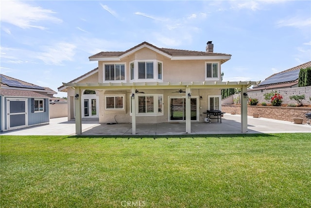13982 Claremont Ln, Rancho Cucamonga, CA 91739 - rear view of property featuring ceiling fan, stucco siding, a chimney, and a patio