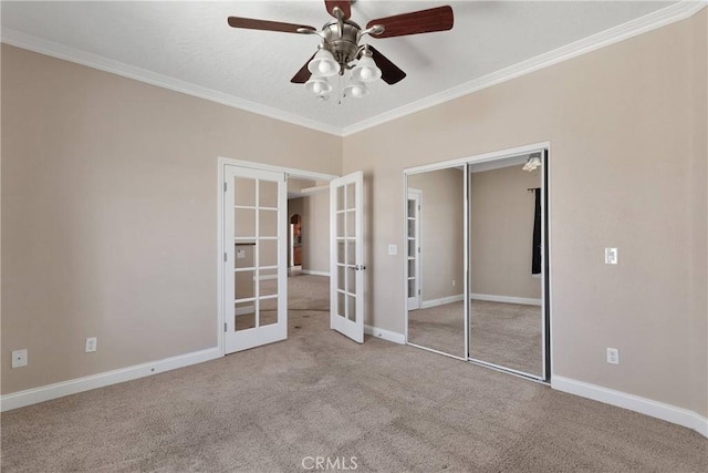15090 Olema Rd, Apple Valley, CA 92307 - unfurnished bedroom with french doors, carpet, crown molding, a closet, and a ceiling fan
