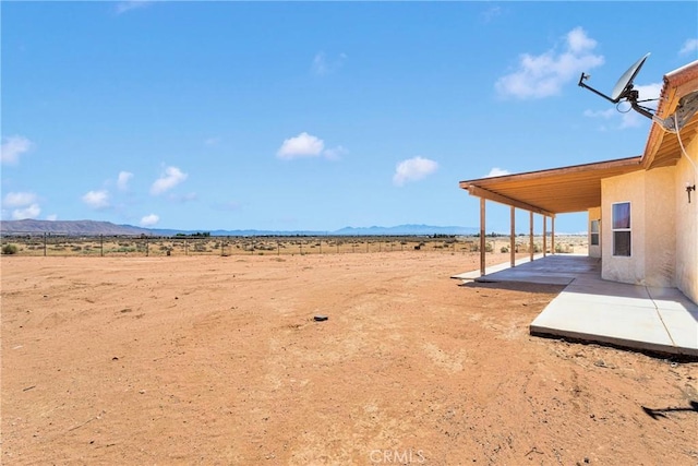 15090 Olema Rd, Apple Valley, CA 92307 - view of yard featuring a patio, a mountain view, a desert view, and a view of countryside