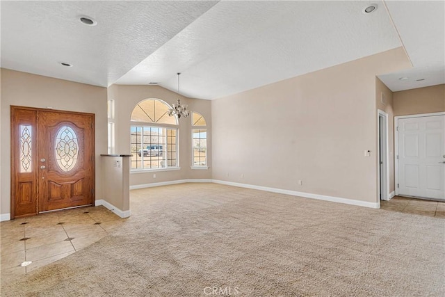 15090 Olema Rd, Apple Valley, CA 92307 - entrance foyer with carpet flooring, a chandelier, lofted ceiling, tile patterned flooring, and a textured ceiling