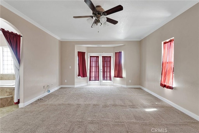 15090 Olema Rd, Apple Valley, CA 92307 - unfurnished room featuring carpet, a ceiling fan, crown molding, french doors, and arched walkways