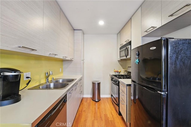 6250 Fulton Ave Unit 104, Van Nuys, CA 91401 - kitchen with stainless steel appliances, light wood-style flooring, light countertops, recessed lighting, and modern cabinets